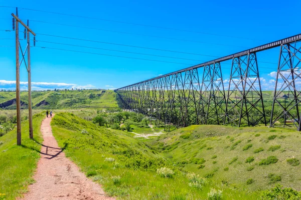 Path by the High Level Bridge in Lethbridge, Alberta, Canada. The bridge is the longest and highest trestle bridge in the world soaring above the Oldman River.