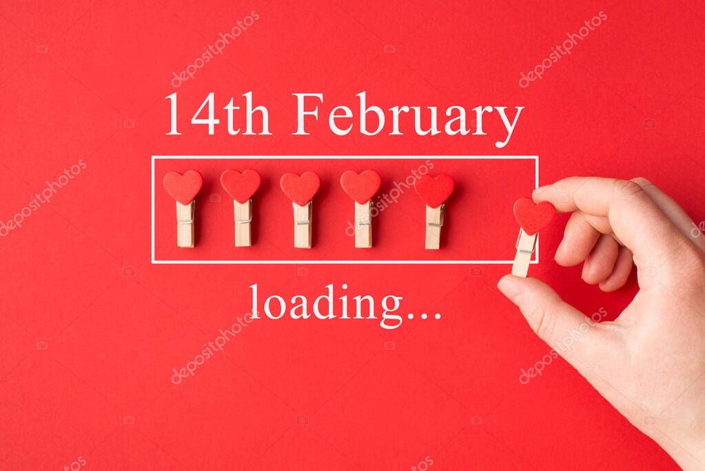Waiting for saint valentines day concept. Cropped top view close up photo image of female hand putting last pin in a line isolated bright color backdrop
