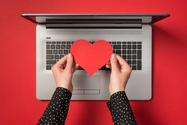 Photo Grey Laptop Hands Holding Red Paper Heart Isolated Red — Stock Photo, Image