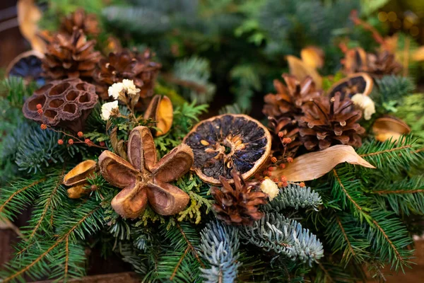 stock image Christmas wreath decorated with cones and dry elements up close