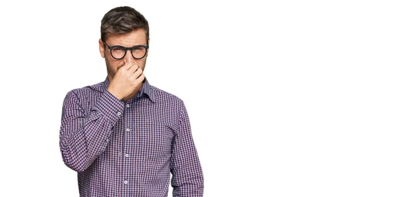 Handsome Caucasian Man Wearing Casual Clothes Glasses Smelling Something Stinky — Stock Photo, Image