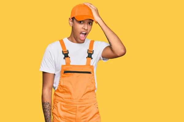 Young Handsome African American Man Wearing Handyman Uniform Surprised Hand — Stock Photo, Image