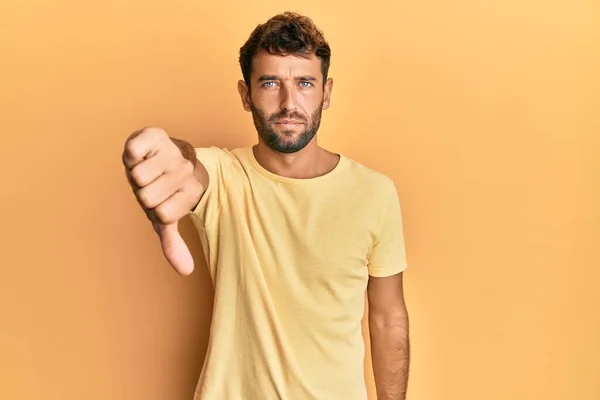 Handsome Man Beard Wearing Casual Yellow Tshirt Yellow Background Looking — Stock Photo, Image