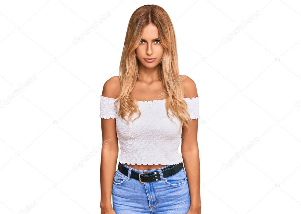 Beautiful blonde young woman wearing casual white tshirt skeptic and nervous, frowning upset because of problem. negative person. 