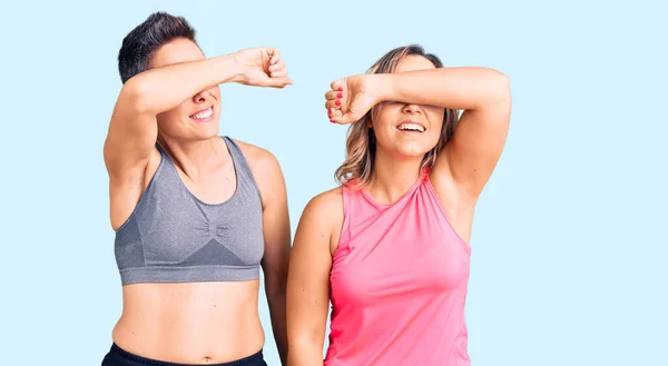 Couple Women Wearing Sportswear Covering Eyes Arm Smiling Cheerful Funny — Stock Photo, Image