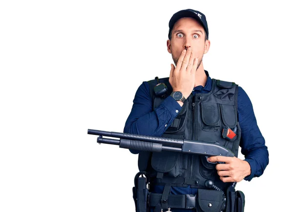 Young Handsome Man Wearing Police Uniform Holding Shotgun Covering Mouth — Stock Photo, Image