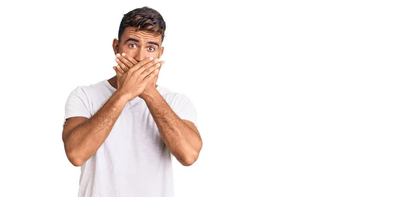 Young Hispanic Man Wearing Casual White Tshirt Shocked Covering Mouth — Stock Photo, Image