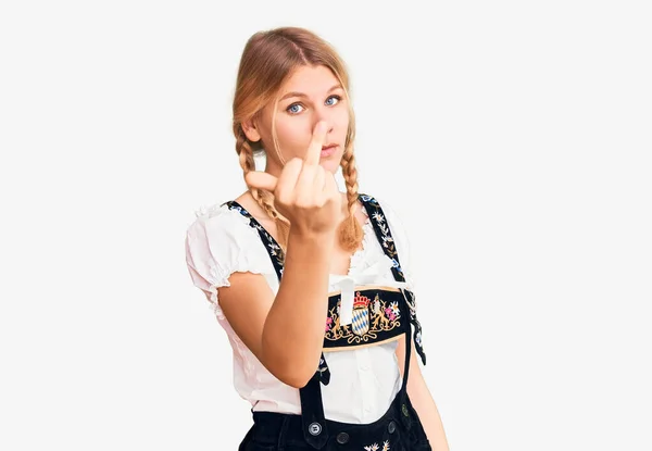 Young Beautiful Blonde Woman Wearing Oktoberfest Dress Showing Middle Finger — Stock Fotó