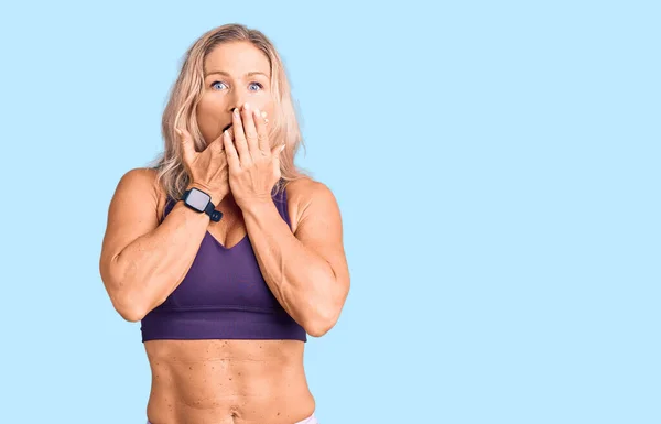 Middle Age Fit Blonde Woman Wearing Sportswear Shocked Covering Mouth — Stock Photo, Image