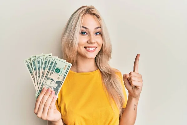 Beautiful Caucasian Blonde Girl Holding Dollars Banknotes Smiling Idea Question — Stock Photo, Image