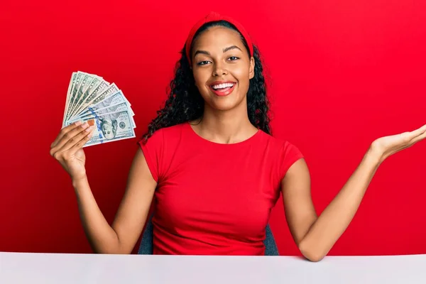 Young African American Girl Holding Dollars Sitting Table Celebrating Achievement — Stock Photo, Image
