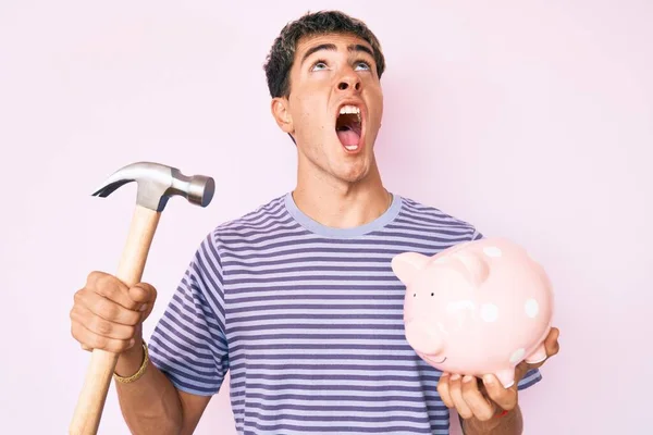 Young Handsome Man Holding Piggy Bank Hammer Angry Mad Screaming — Stock Photo, Image