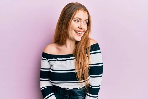 Young Beautiful Redhead Woman Wearing Striped Sweater Pink Background Looking — Stock Photo, Image