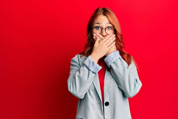 Young Redhead Woman Wearing Business Jacket Glasses Shocked Covering Mouth — Stock Photo, Image