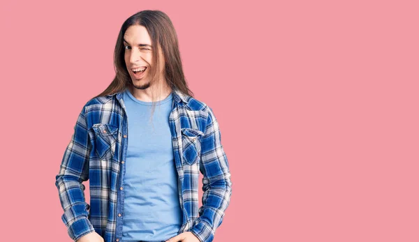 Young Adult Man Long Hair Wearing Casual Shirt Winking Looking — Stock Photo, Image