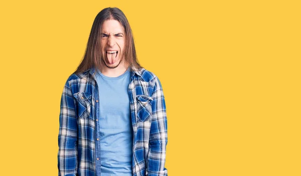 Young Adult Man Long Hair Wearing Casual Shirt Sticking Tongue — Stock Photo, Image