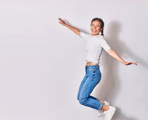 Young Beautiful Woman Braids Wearing Casual Clothes Smiling Happy Jumping — Stock Photo, Image