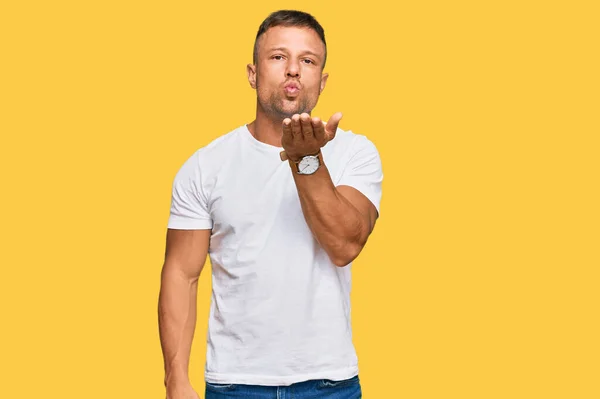 Handsome Muscle Man Wearing Casual White Tshirt Looking Camera Blowing — Stock Photo, Image