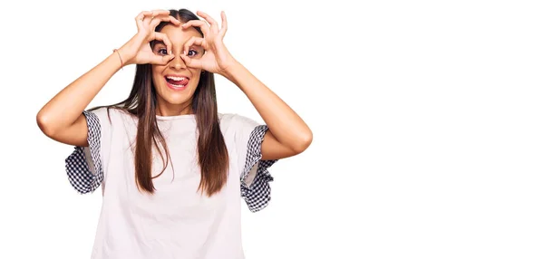 Young Hispanic Woman Wearing Casual Clothes Doing Gesture Binoculars Sticking — Stock Photo, Image