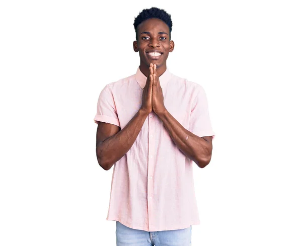 Young African American Man Wearing Casual Clothes Praying Hands Together — Stock Photo, Image