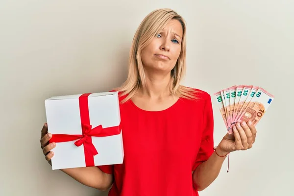 Middle Age Caucasian Woman Holding Gift Euros Banknotes Clueless Confused — Stock Photo, Image