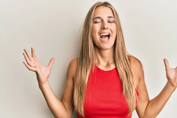 Young Blonde Woman Wearing Casual Clothes Celebrating Mad Crazy Success — Stock Photo, Image