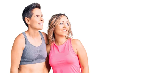 Couple Women Wearing Sportswear Looking Away Side Smile Face Natural — Stock Photo, Image