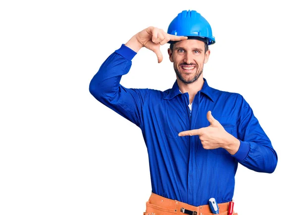 Jovem Homem Bonito Vestindo Uniforme Trabalhador Hardhat Sorrindo Fazendo Moldura — Fotografia de Stock