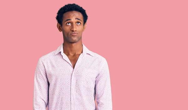 African Handsome Man Wearing Casual Pink Shirt Depressed Worry Distress — Stock Photo, Image