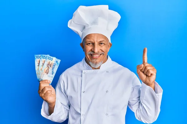 Middle Age Grey Haired Man Wearing Professional Cook Uniform Holding — Stock Photo, Image