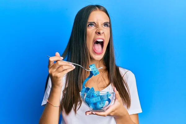 Young Hispanic Woman Eating Measure Meter Doing Diet Weight Loss — Stock Photo, Image