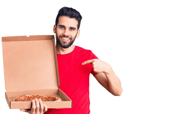 Young Handsome Man Beard Holding Delivery Cardboard Italian Pizza Pointing — Stock Photo, Image