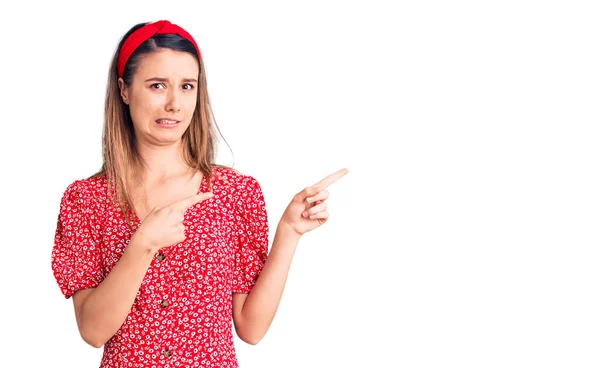 Young Beautiful Girl Wearing Dress Diadem Pointing Aside Worried Nervous — Stock Photo, Image