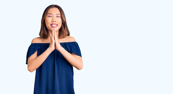 Young Beautiful Chinese Girl Wearing Casual Clothes Praying Hands Together — Stock Photo, Image