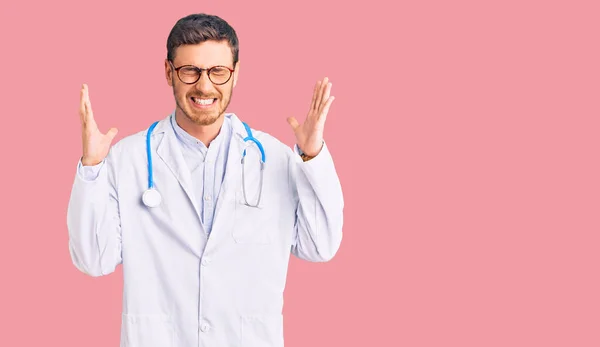 Handsome Young Man Bear Wearing Doctor Uniform Celebrating Mad Crazy — Stock Photo, Image