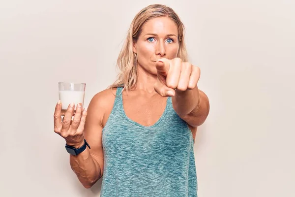 Middle Age Caucasian Blonde Woman Holding Glass Milk Pointing Finger — Stock Photo, Image