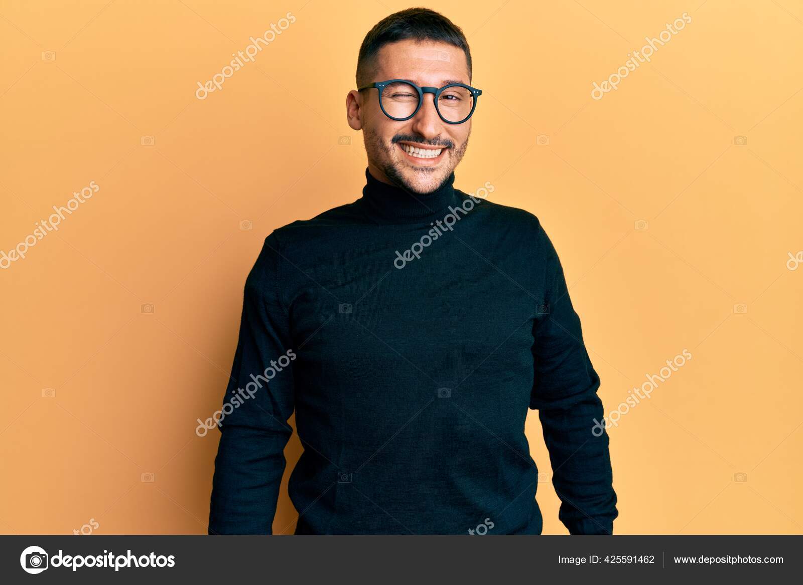 A man with a goatee and a turtle neck sweater photo – Man face