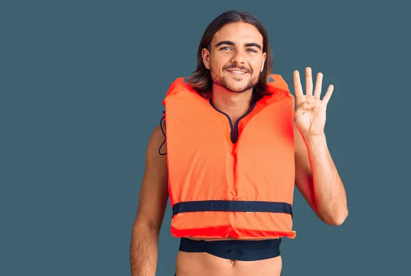 Young Handsome Man Wearing Nautical Lifejacket Showing Pointing Fingers Number — Stock Photo, Image