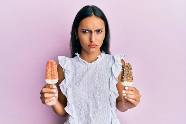 Young Brunette Arab Woman Holding Ice Cream Skeptic Nervous Frowning — Stock Photo, Image