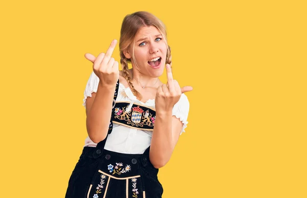 Young Beautiful Blonde Woman Wearing Oktoberfest Dress Showing Middle Finger — Stok fotoğraf