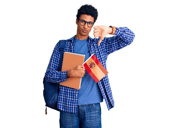 Young African American Man Wearing Student Backpack Holding Spanish Flag — Fotografia de Stock