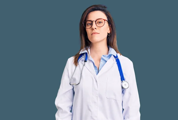 Young Beautiful Woman Wearing Doctor Stethoscope Glasses Relaxed Serious Expression — Stock Photo, Image