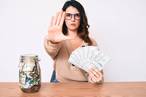 Young Beautiful Brunette Woman Holding Jar Savings Holding Dollars Open — Stockfoto