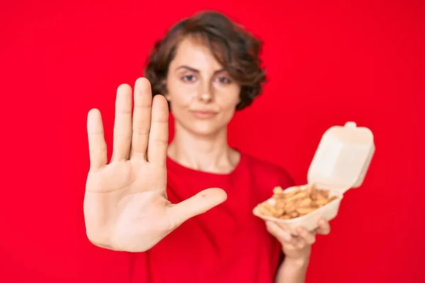 Young Hispanic Woman Holding Potato Chip Open Hand Doing Stop — Stock Photo, Image