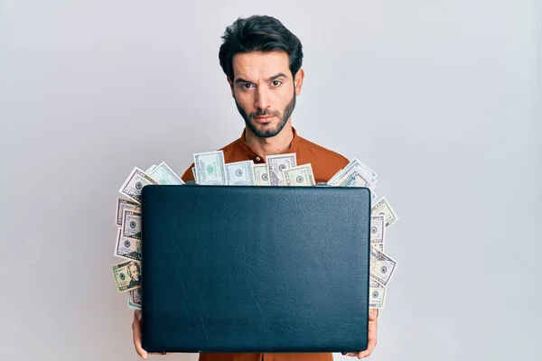 Young Hispanic Man Holding Briefcase Dollars Relaxed Serious Expression Face — Stock Photo, Image