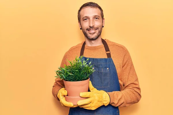 Young Handsome Man Wearing Gardener Apron Gloves Holding Plant Pot — Stock Photo, Image