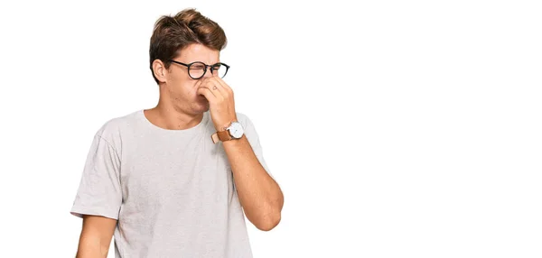 Handsome Caucasian Man Wearing Casual Clothes Glasses Smelling Something Stinky — Stock Photo, Image