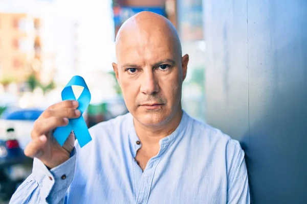 Middle Age Bald Man Serious Expression Holding Blue Prostate Cancer — Stock Photo, Image