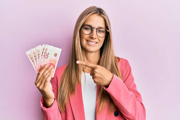 Young Blonde Woman Wearing Business Style Holding Israel Shekels Smiling — Stock Photo, Image