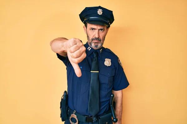 Middelbare Leeftijd Latino Man Draagt Politie Uniform Kijken Ongelukkig Boos — Stockfoto